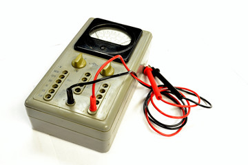 Old analog multimeter isolated on the white background