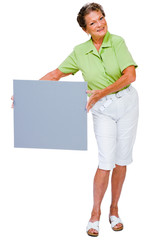 Smiling woman showing placard