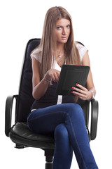 Beautiful Woman in Chair With Tablet Computer