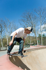 Skateboarder Falling Into the Bowl at the Skate Park