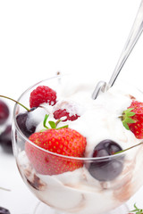 ice cream, cherries, raspberries, strawberries and spoon isolate