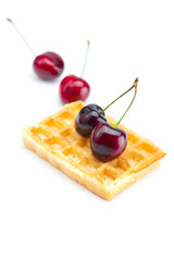 waffles and cherries isolated on white
