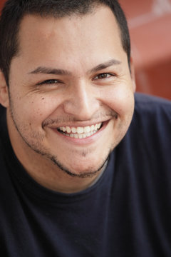 Young Latino male smiling