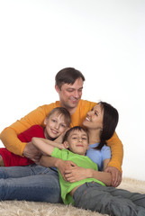 Fototapeta premium happy family on a carpet
