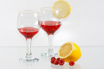 The transparent red liquor and lemon