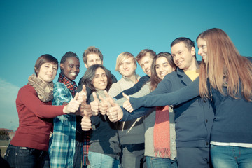 Happy College Students with Thumbs Up.