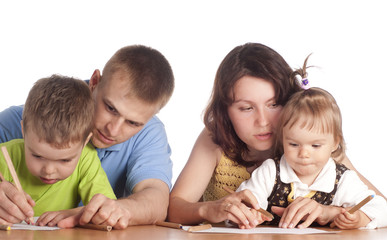 family drawing at table