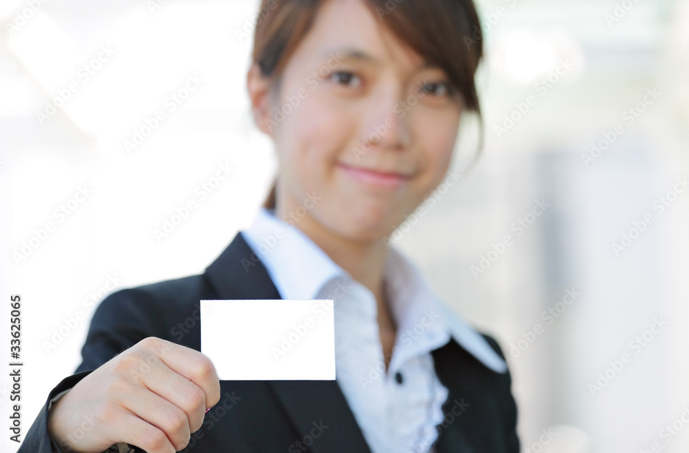 Wall mural business woman showing blank card