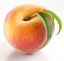 Ripe peach with leaves