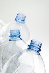 recyclable plastic bottles over white background