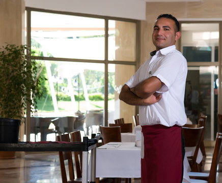 Waiter ready to serve customers.