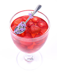 Jelly with strawberries decorated with a lavender twig