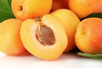 apricots with leaves isolated on white
