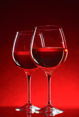 wine glasses on red background