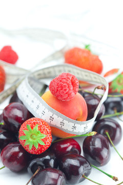 measure tape,strawberry, apricot, cherry and raspberry isolated