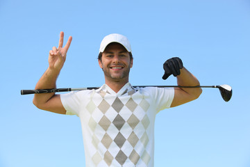 Happy golfer giving peace sign - Powered by Adobe
