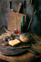 Still life with cheese and red wine