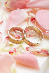 golden rings and rose petals