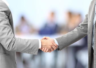 Business men hand shake in the office