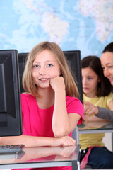 Portrait of blond school girl in class