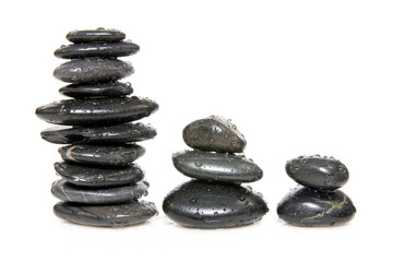 three stacks of stones isolated on white background.
