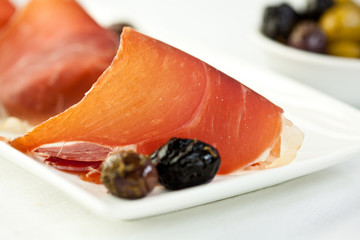 Smoked, cured ham on a plate