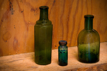 Still Life with differently shaped glass bottles