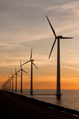 Long row of windturbines in the sea