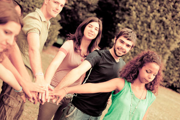 Fototapeta premium Happy Teenage Group with Hands on Stack