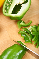 chopping sweet peppers on a chopping board