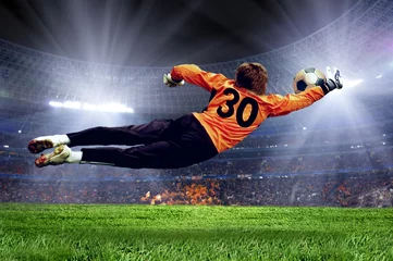 Acrylic prints Football Football goalman on the stadium field