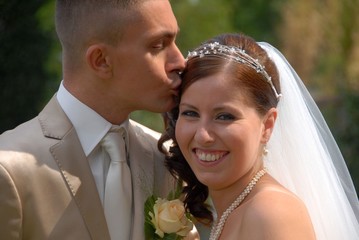 Groom kissing his bride