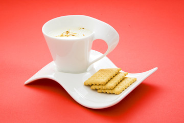 cup of milk on red background