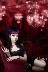 Fototapeta premium Come into my Lair - Vampire on red Velvet Couch