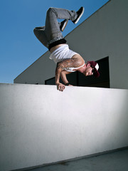 hand stand on a wall