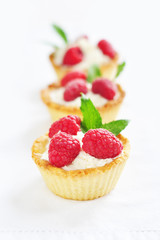 Raspberry tarts in a row