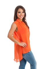 Happy young woman in orange top against white