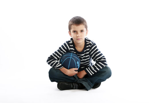 Boy holding basketball ball