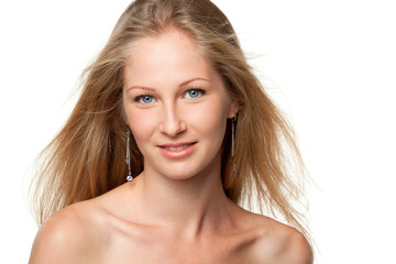 Fototapeta premium Closeup portrait of beautiful female model with flying hair
