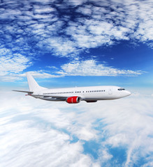Fototapeta premium Airplane above clouds