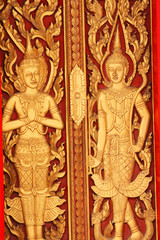 Fototapeta na wymiar Sculpture door in temple in Thailand.
