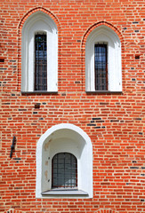 window in red brick wall