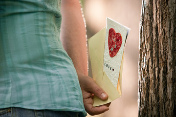 A man holds a card in his hand