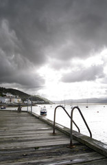 Fototapeta premium view from boardwalk onto stormy sea