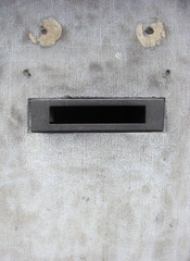 grunge wall with mail box looking like funny face