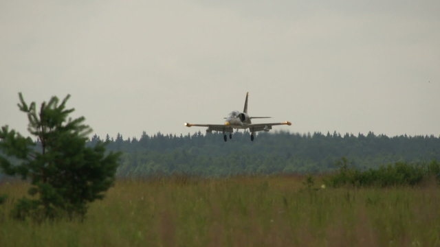 jet fighter landing on air base