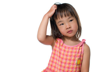 頭をかく女の子