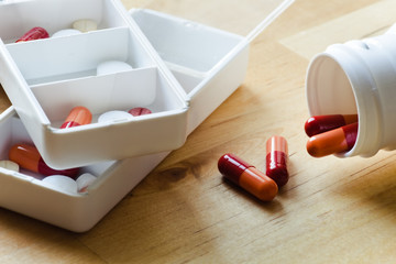 Pills, capsules and tablets sorted in pillbox
