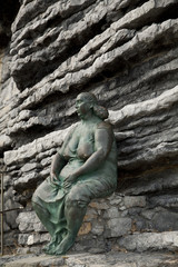 Fototapeta na wymiar Bronze statue on the rock