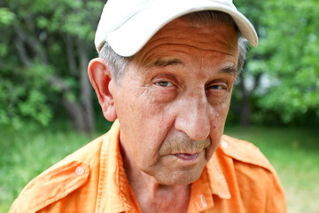 sly elderly man smiling